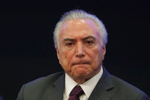The Latest: Brazil President Denies OK'ing Bribe
