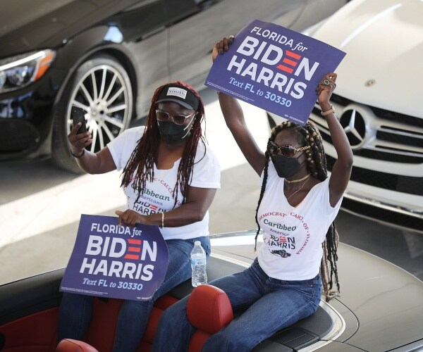 joe biden supporters sit in car