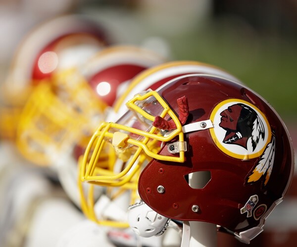 a washington redskins helmet with a logo of a native american