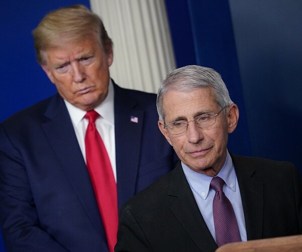 donald trump stands behind anthony fauci