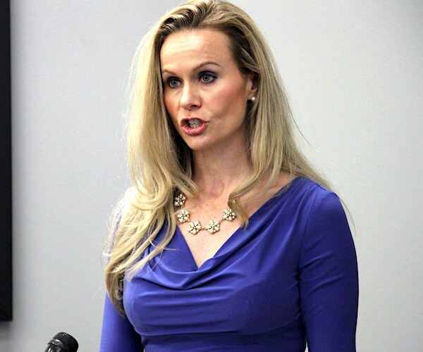 kelly tshibaka speaks during a news conference