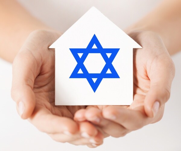 hands holding a house with a star of david