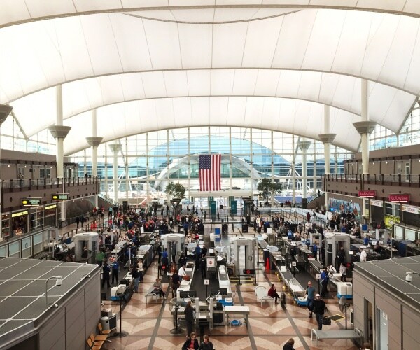 travelers coming going through airport security