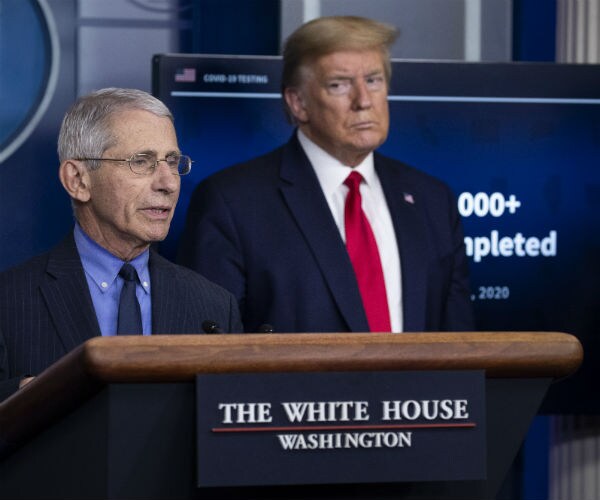 dr anthony fauci of national institute of allergy and infectious diseases as president trump listens
