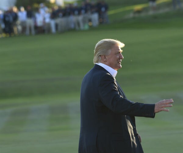 donald trump walking on golf course