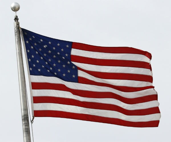 an american flag flying in the breeze