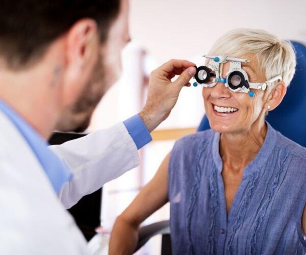 woman getting eye exam