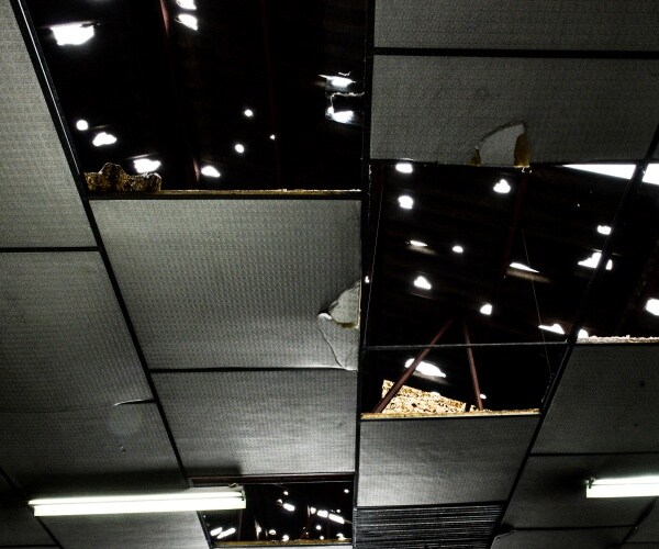 damage to the roof of a car dealership
