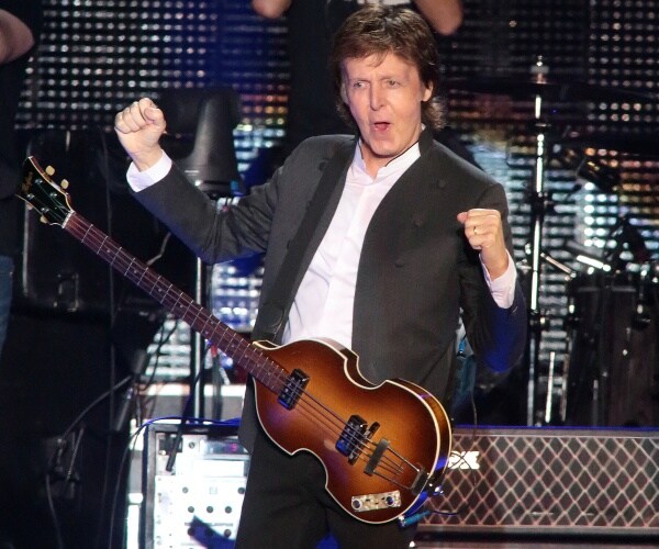 paul mccartney performs on stage