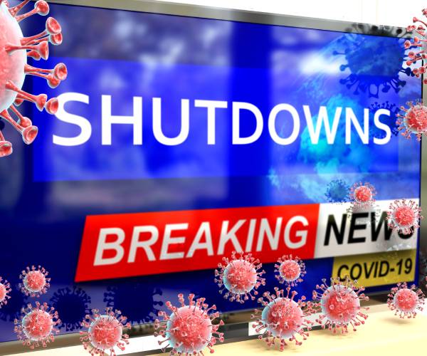 a television screen surrounded by covid germs and reading breaking news shutdowns covid nineteen