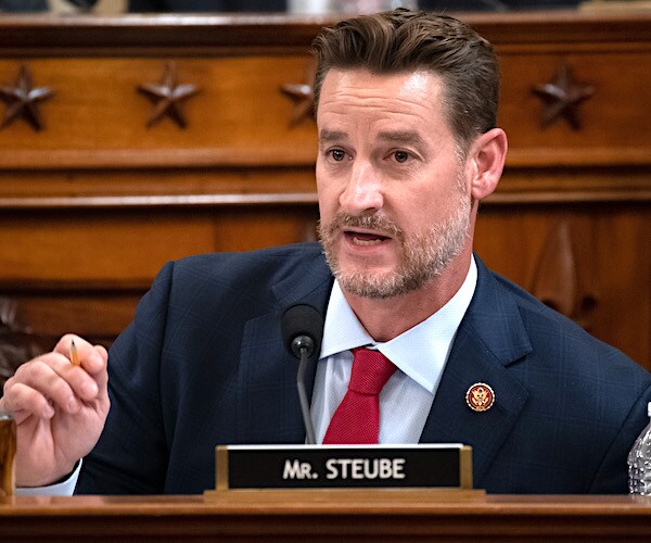 greg steube gestures as he speaks during a house committee hearing
