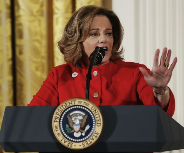 k.t. mcfarland is seen at the white house in a red suit