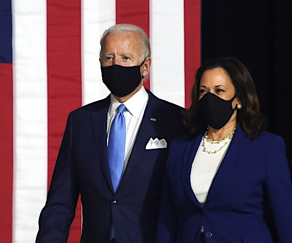 joe biden and kamala harris walk out with face masks at their first co-op event