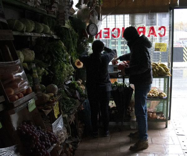 a customer shops in the dark in a grocery store