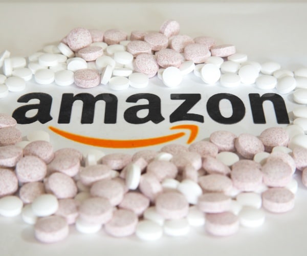 Amazon logo with white pills around it