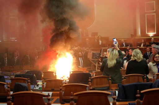 The Albanian Opposition Disrupts a Parliament Vote on the Budget with Flares and Piled-up Chairs
