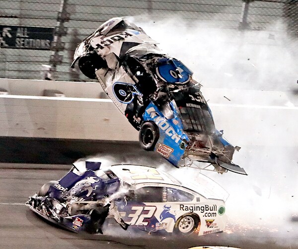 Ryan Newman (6) goes airborne as Corey LaJoie (32) crashes in to him on the final lap of the Daytona 500