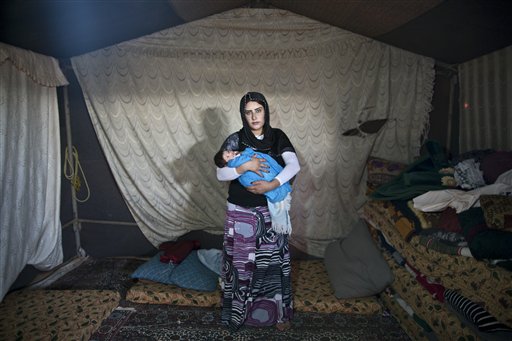 AP PHOTOS: Syrian Refugee Mothers Care, Fear for Newborns