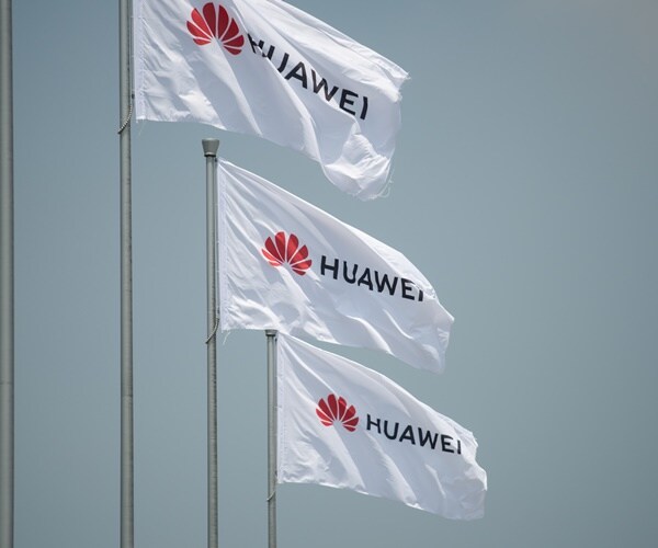 huawei flags fly at a tech convention