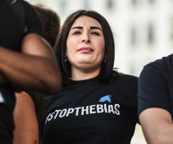 loomer in a black t shirt with stop the bias and the twitter logo on it