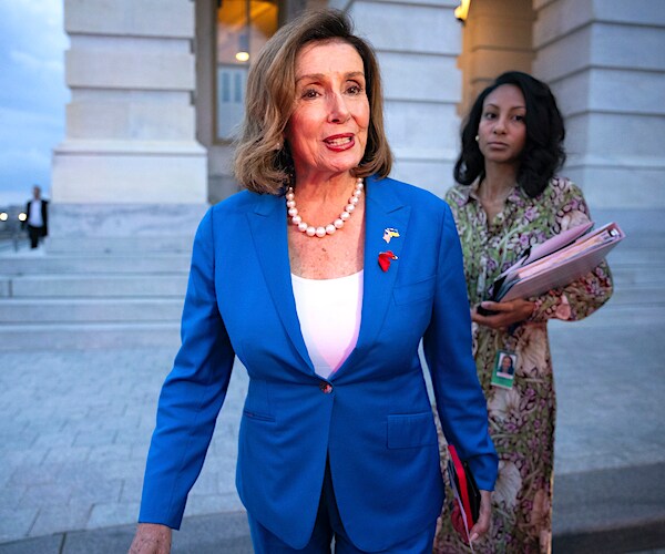 Nancy Pelosi walking outside the capitol