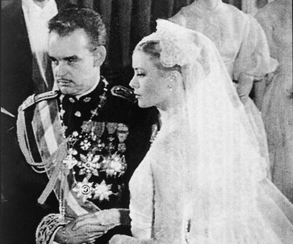 prince rainier and grace kelly stand at altar during wedding ceremony