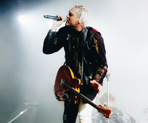 win butler of arcade fire performing