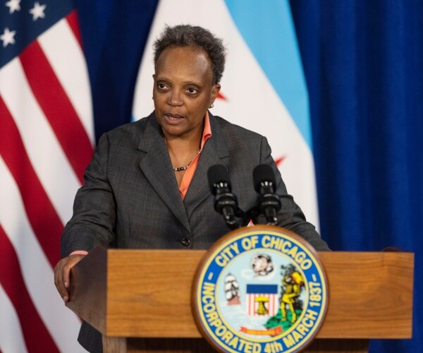 lori lightfoot speaks at a news conference