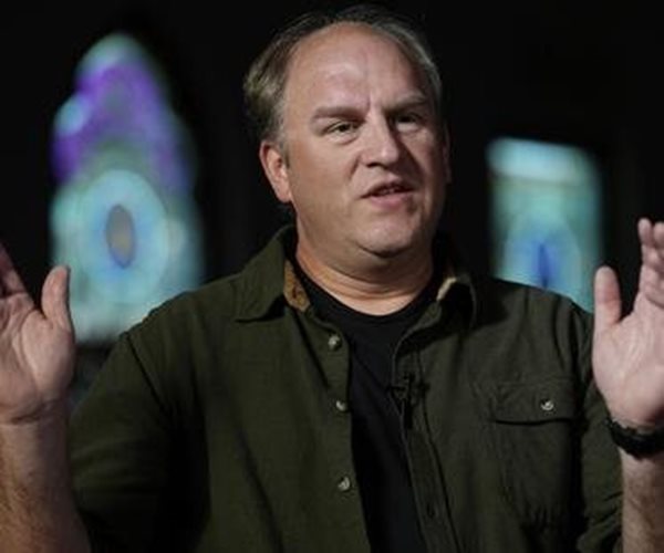 Gerald Groff raises his hands while speaking