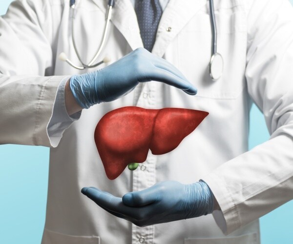 physician with illustration of liver in front of him