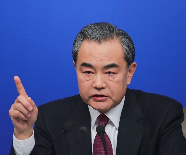 Wang Yi attends a press conference