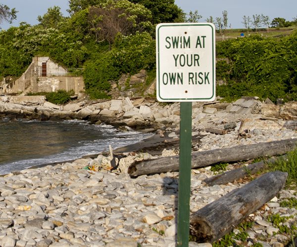 A swim at your own risk sign