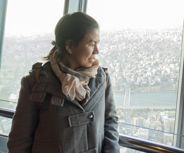 japanes woman looking out window