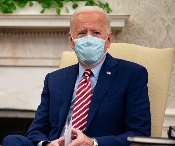 joe biden sits in oval office