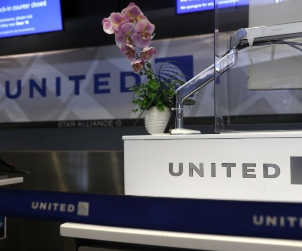 orchids sit on the united ticket counter