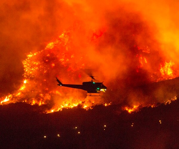 Helicopters Rescue Dozens Trapped by California Wildfire