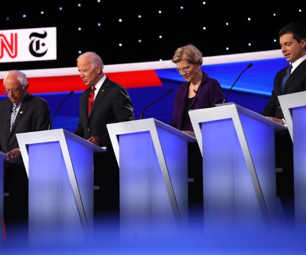 democratic presidential candidates look down during a primary debate in october
