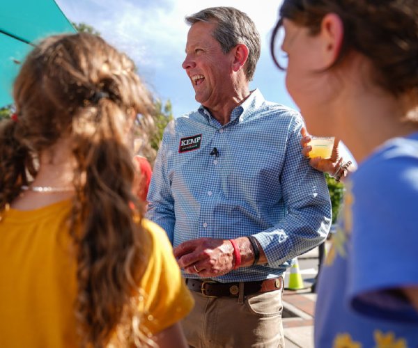 georgia gov brian kemp greets attendees at a campaign event