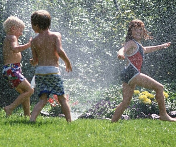 kids playing in sprinklers