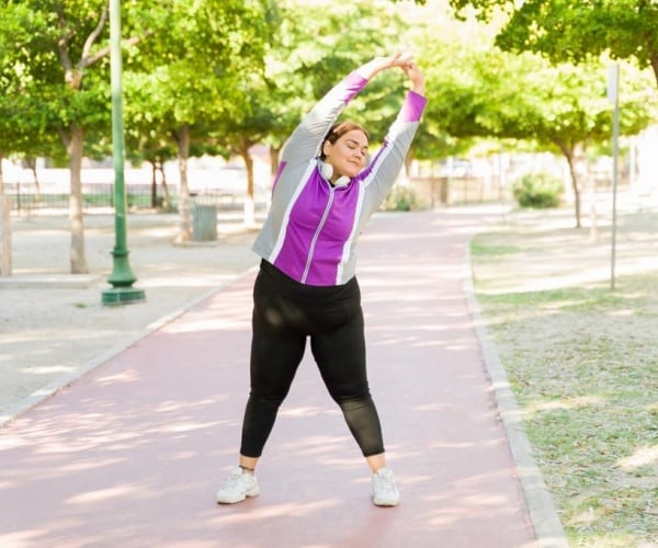 woman in park exercising