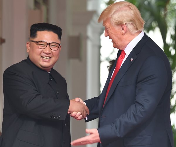 smiling north korea leader kim jong un shakes hands with president donald trump in june 20198