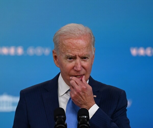 joe biden speaks into mic