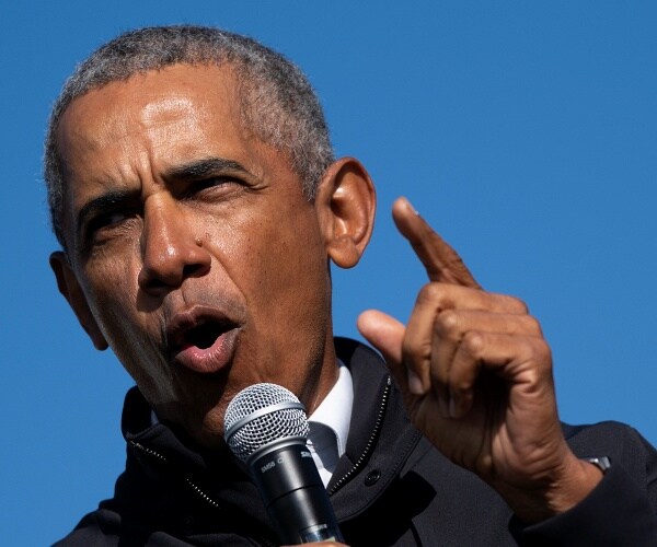 barack obama speaks into microphone at campaign rally