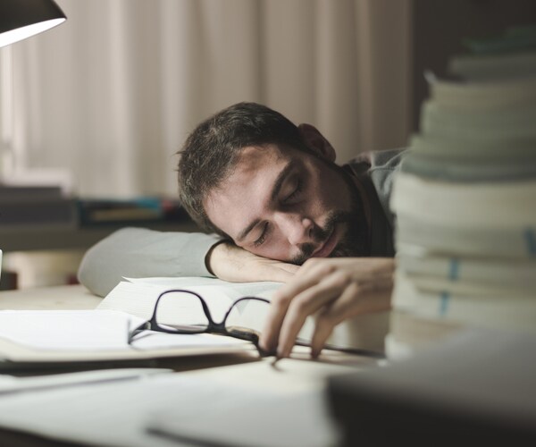 a man sleeping at his desk
