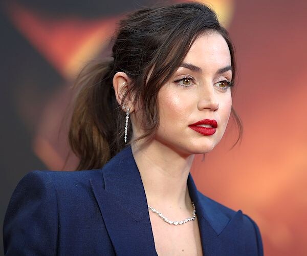 Actress Ana de Armas stands on the red carpet