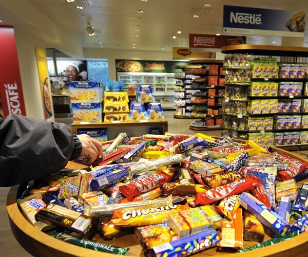 A selection of Nestle chocolate bars in a supermarket.