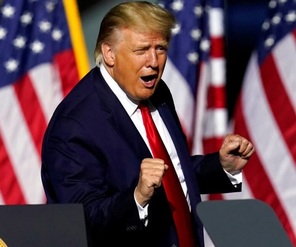 donald trump dancing in front of u.s. flags