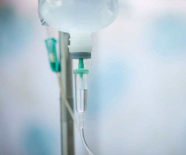 IV pole, with infusion bag