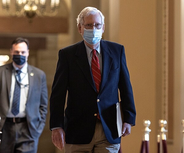 mitch mcconnell walks down hall