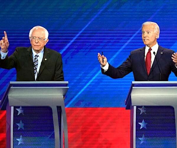 bernie sanders and joe biden exult during a debate